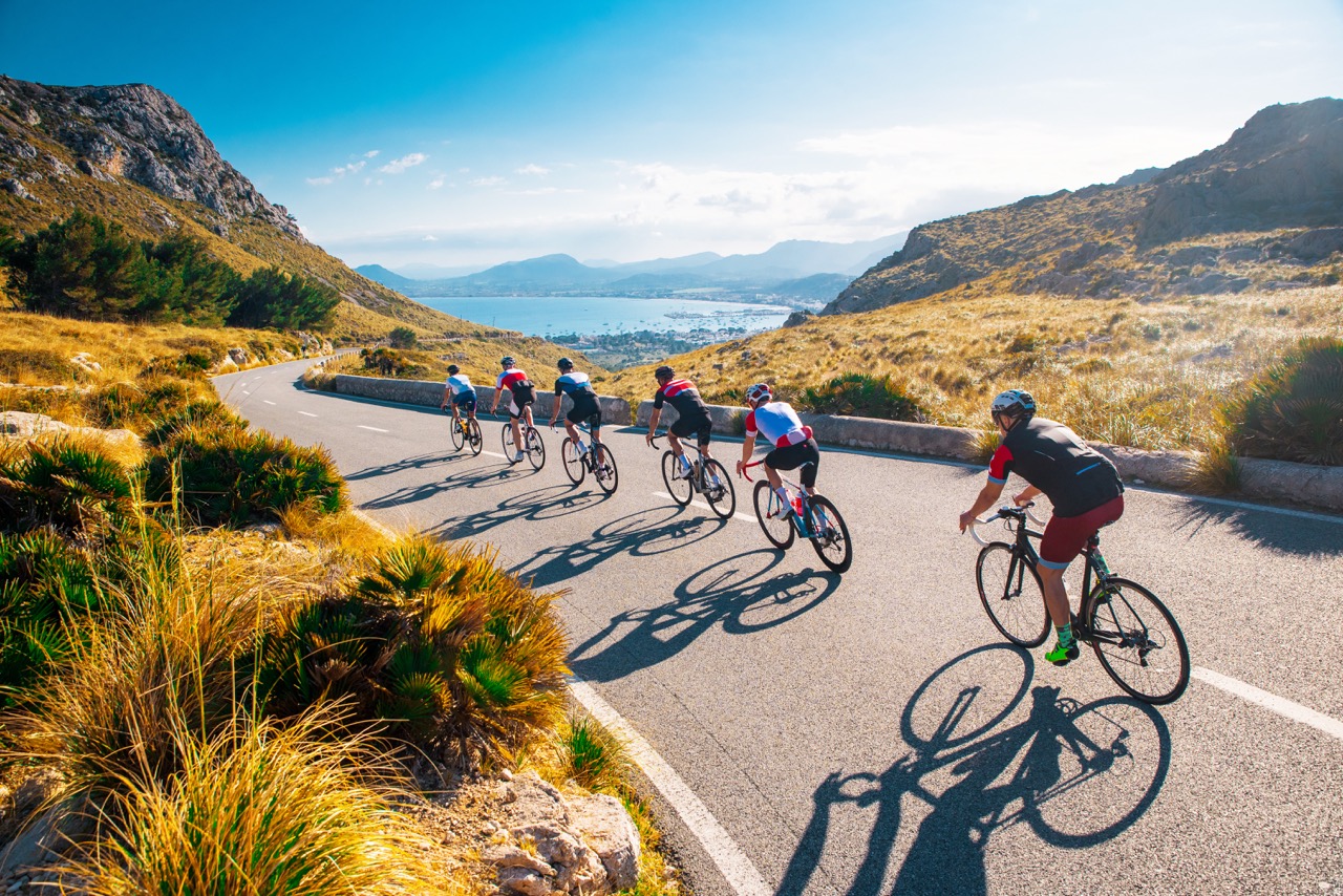 Groupe vélom escapadesoup of triathlete on bicycle ride on the road at Mallorca, Majorca, Spain.